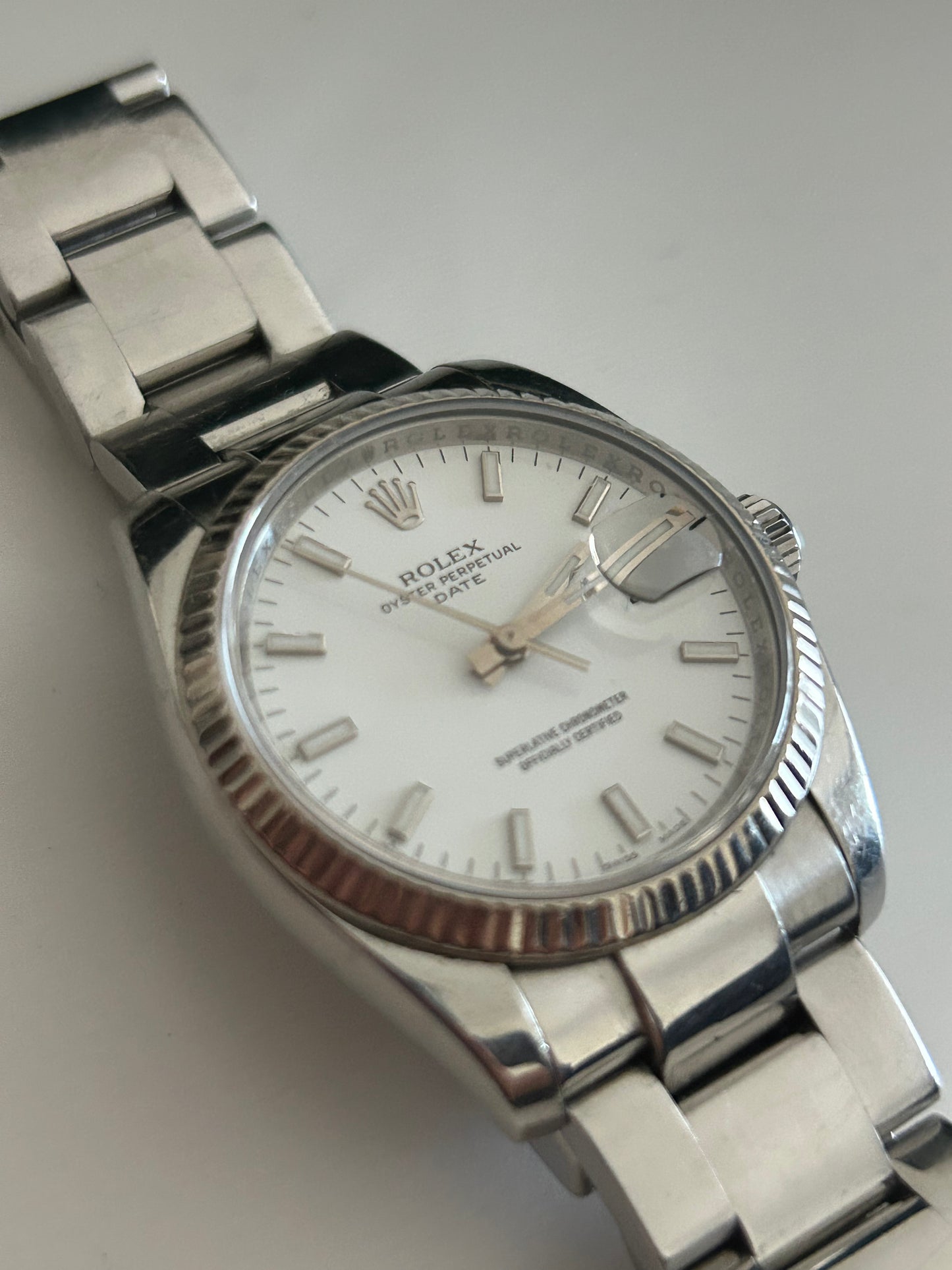 Rolex Date 115234 white gold bazel